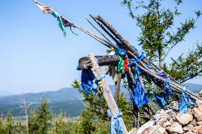 Low angle view of clothes hanging on rope against sky