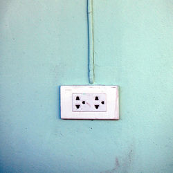 Close-up of telephone booth on wall