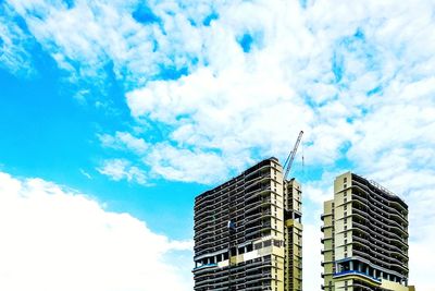 Low angle view of skyscrapers against sky