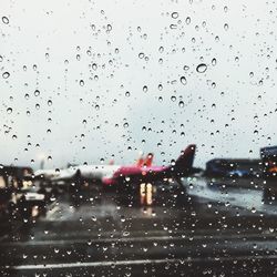 Close-up of wet car windshield during rainy season