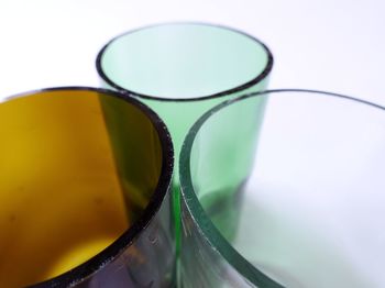 High angle view of drinking glasses against white background