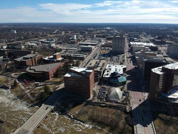 High angle view of buildings in city against sky