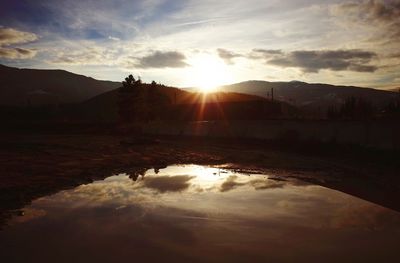 Scenic view of landscape against sky during sunset