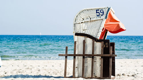 Hooded beach chair on sandy beach