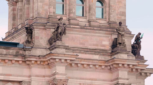 Low angle view of statue of historic building