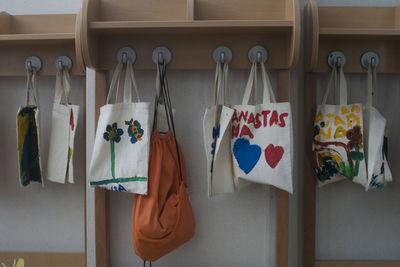 Bags hanging on hooks in room