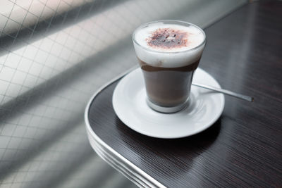 High angle view of coffee cup on table