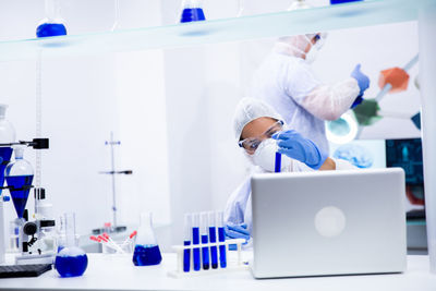 Scientist examining tube in laboratory at hospital