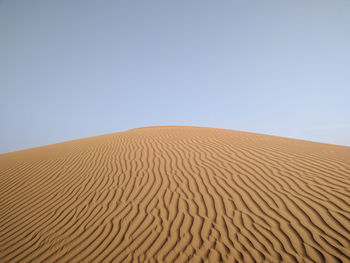 Scenic view of desert against clear sky