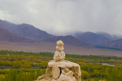 Rocks on mountain against sky