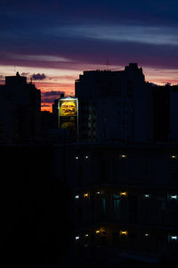 Buildings in city at night