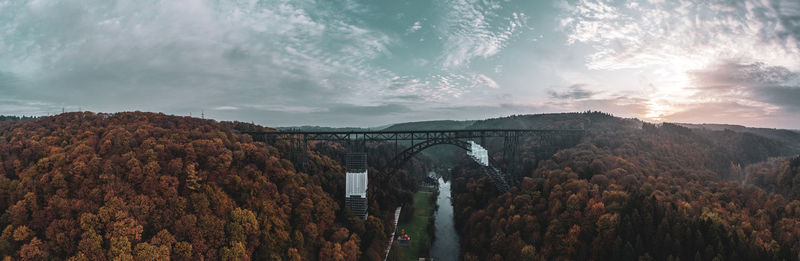 Arch bridge against sky during autumn