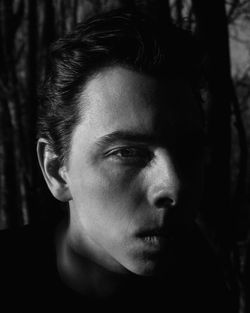 Close-up portrait of young man looking away