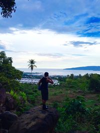 Silhouette of woman standing on beach