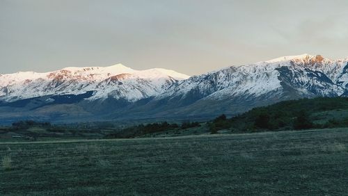 Scenic view of snowcapped mountains against sky