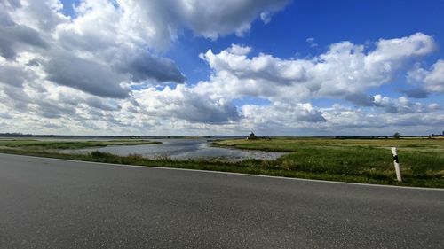 Road by land against sky