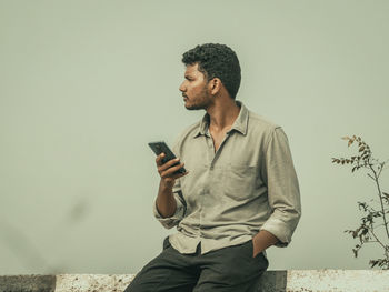 Young man using mobile phone