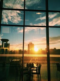 Scenic view of sunset seen through glass window