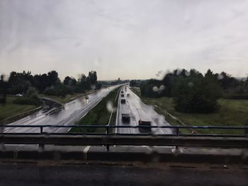 Cars on road against sky