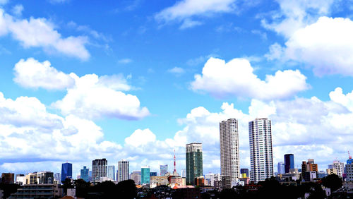 Modern buildings in city against sky