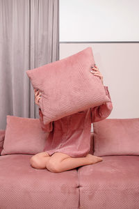 Close-up of pink toy on bed at home