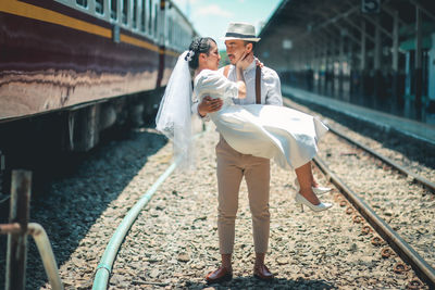 People standing on railroad track