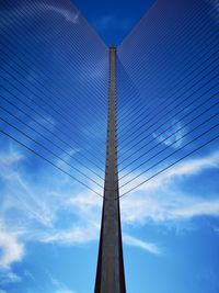 Low angle view of bridge against blue sky