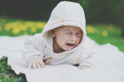 Cute baby crying at park