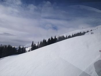 Scenic view of snow covered landscape against sky