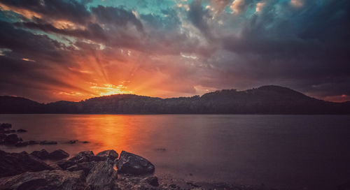 Scenic view of sea against cloudy sky