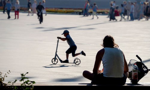 People riding motorcycle on street