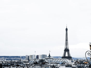 Buildings in city against clear sky