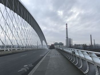 View of bridge against cloudy sky