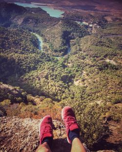 Low section of hiker standing on mountain