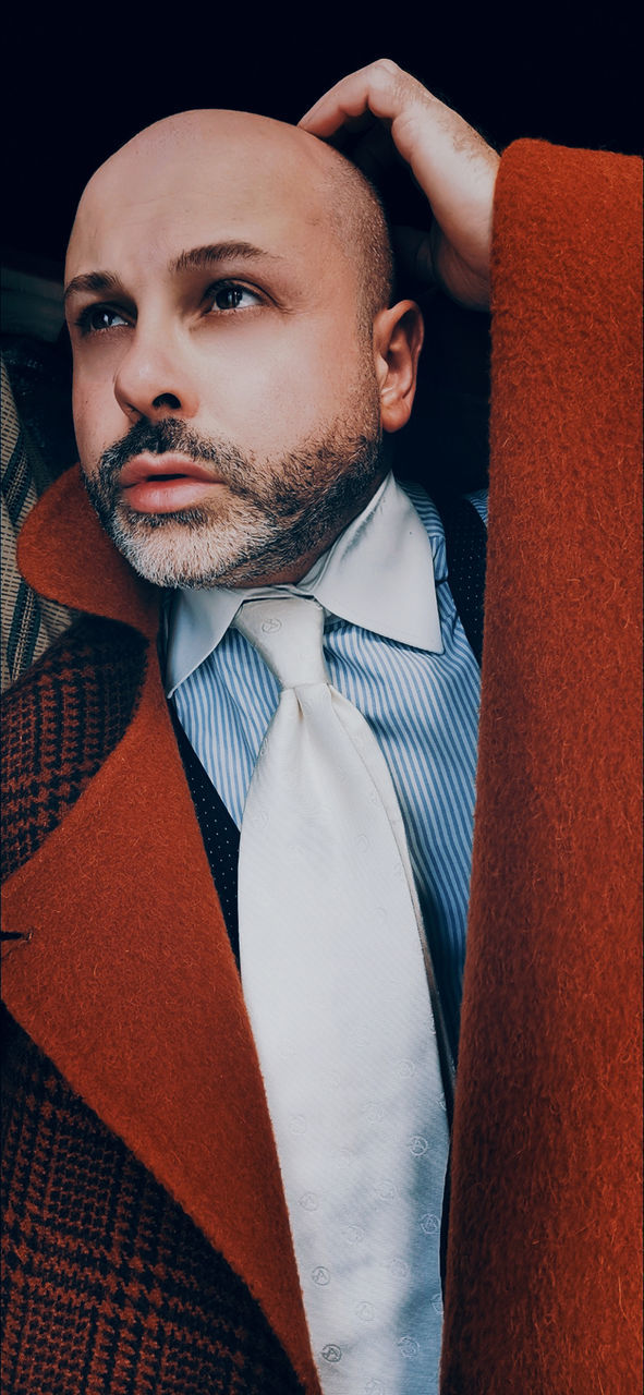 one person, adult, men, facial hair, portrait, beard, indoors, looking at camera, person, clothing, front view, young adult, tie, waist up, lifestyles, menswear, necktie, looking, red, studio shot, business, businessman, human hair, human face