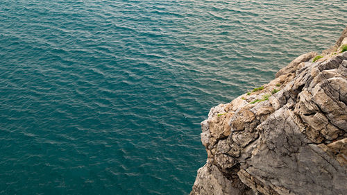 High angle view of rock formation in sea