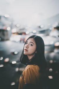 Portrait of young woman looking away