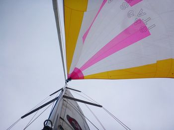 Low angle view of sailboat against clear sky