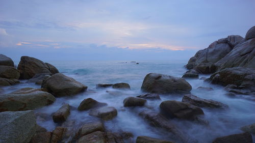 Scenic view of sea against sky at sunset