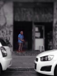 Full length of a man skateboarding on road