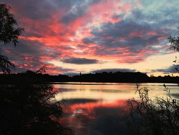 Scenic view of calm lake at sunset