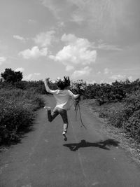 Full length of woman on field against sky