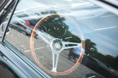 Reflection of car on side-view mirror