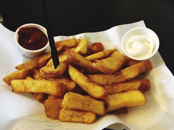 Close-up of burger and fries with sauce