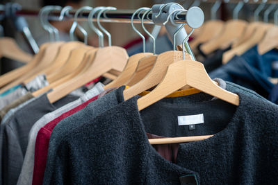 Clothes hanging on rack in store