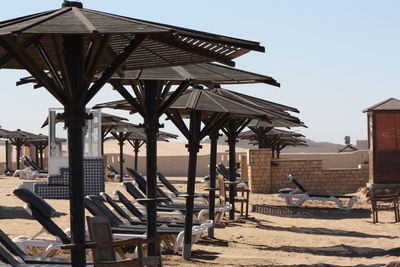 Built structure on beach against clear sky