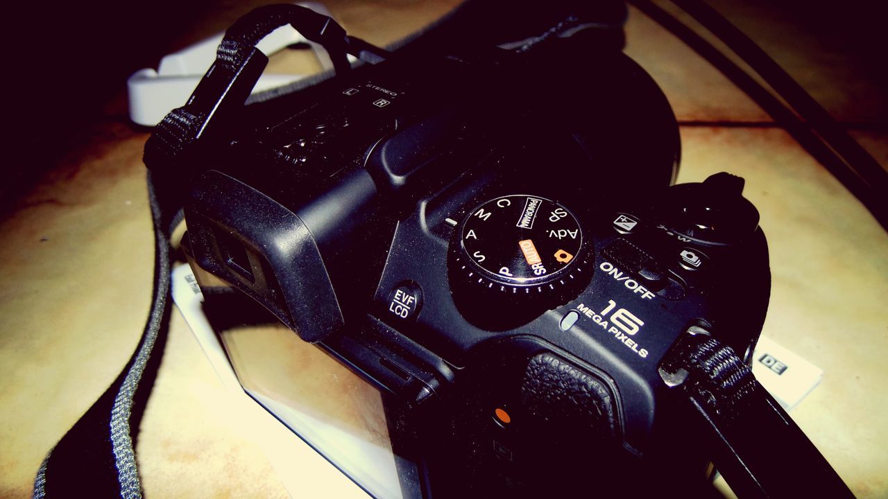 indoors, still life, high angle view, close-up, technology, table, communication, music, arts culture and entertainment, black color, no people, text, connection, wireless technology, musical instrument, retro styled, photography themes, equipment, old-fashioned, paper