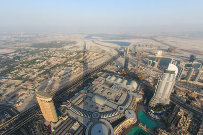 Aerial view of cityscape against sky