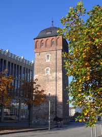 Clock tower against clear blue sky