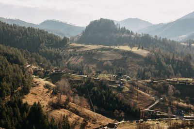 High angle view of trees and mountains against sky